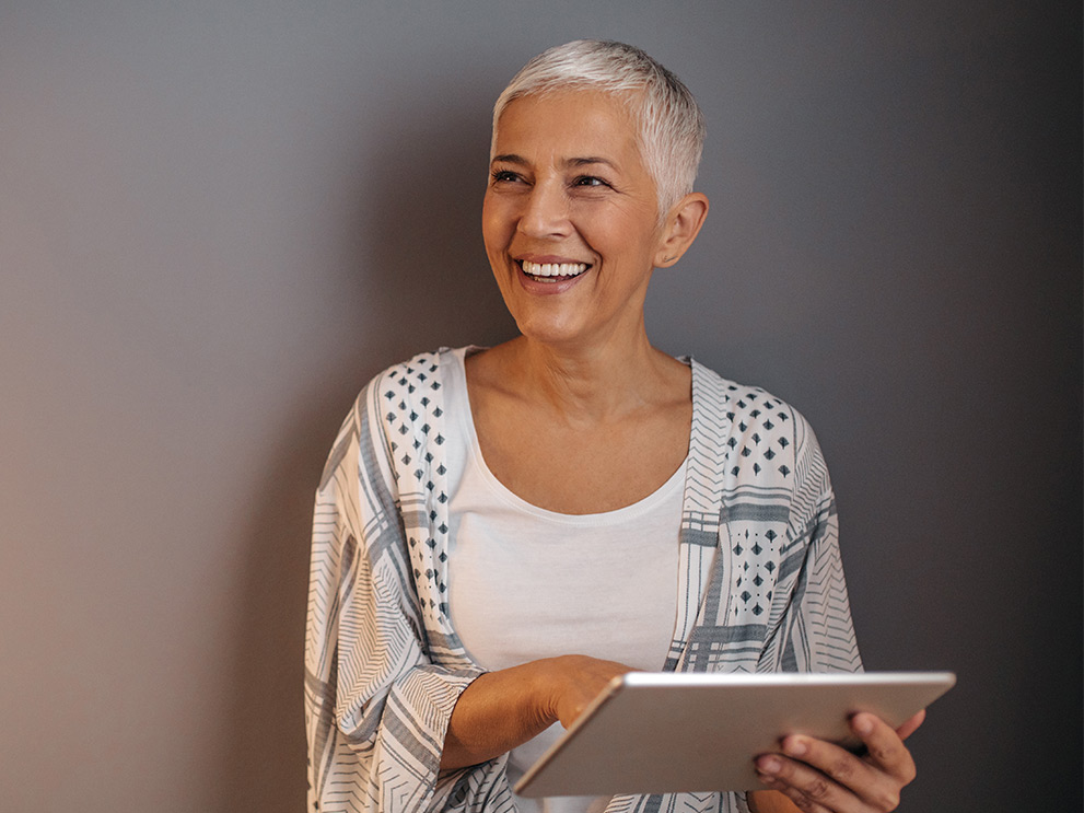 Mature woman using her tablet